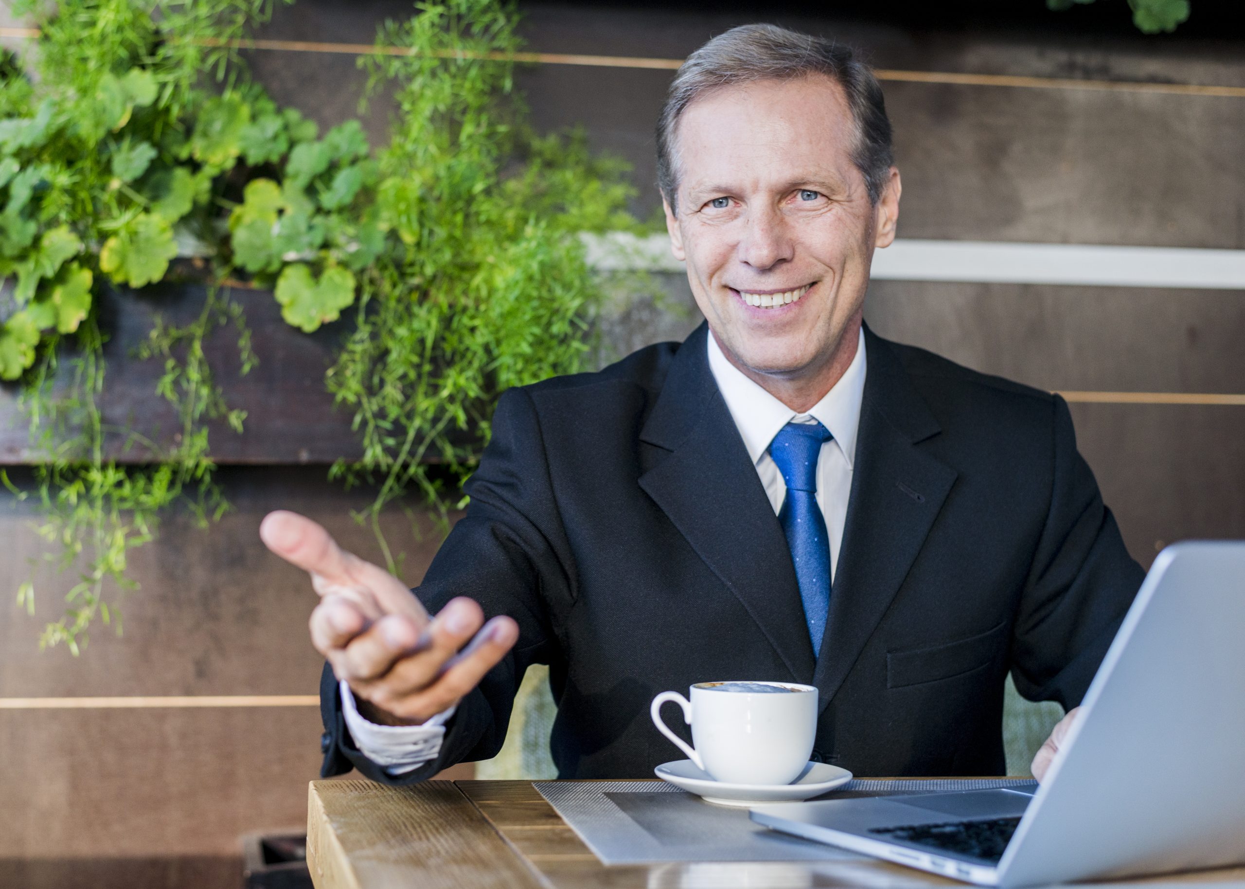 https://foreclosuresurplusfunds.org/wp-content/uploads/2024/03/happy-businessman-making-hand-gesture-with-cup-coffee-laptop-desk-scaled.jpg